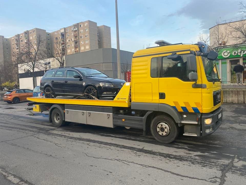 Jeff Car Towing Center yellow flatbed tow truck